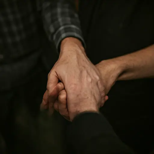 Hands joining together